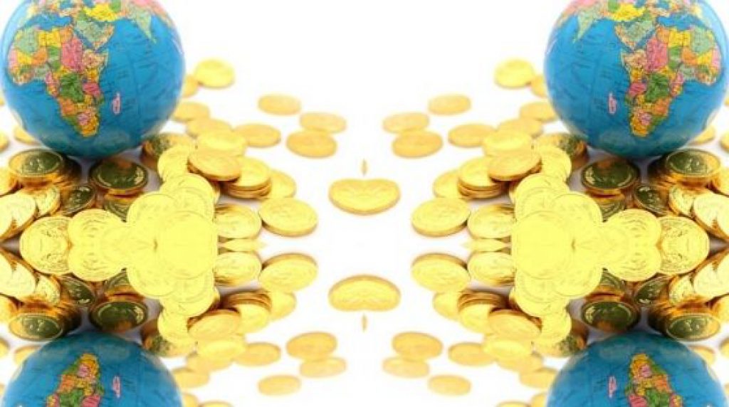  A symmetrical image of two globes placed on stacks of gold coins.