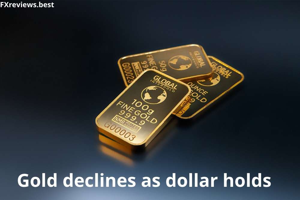 Gold declines as dollar holds firm over further sanctions